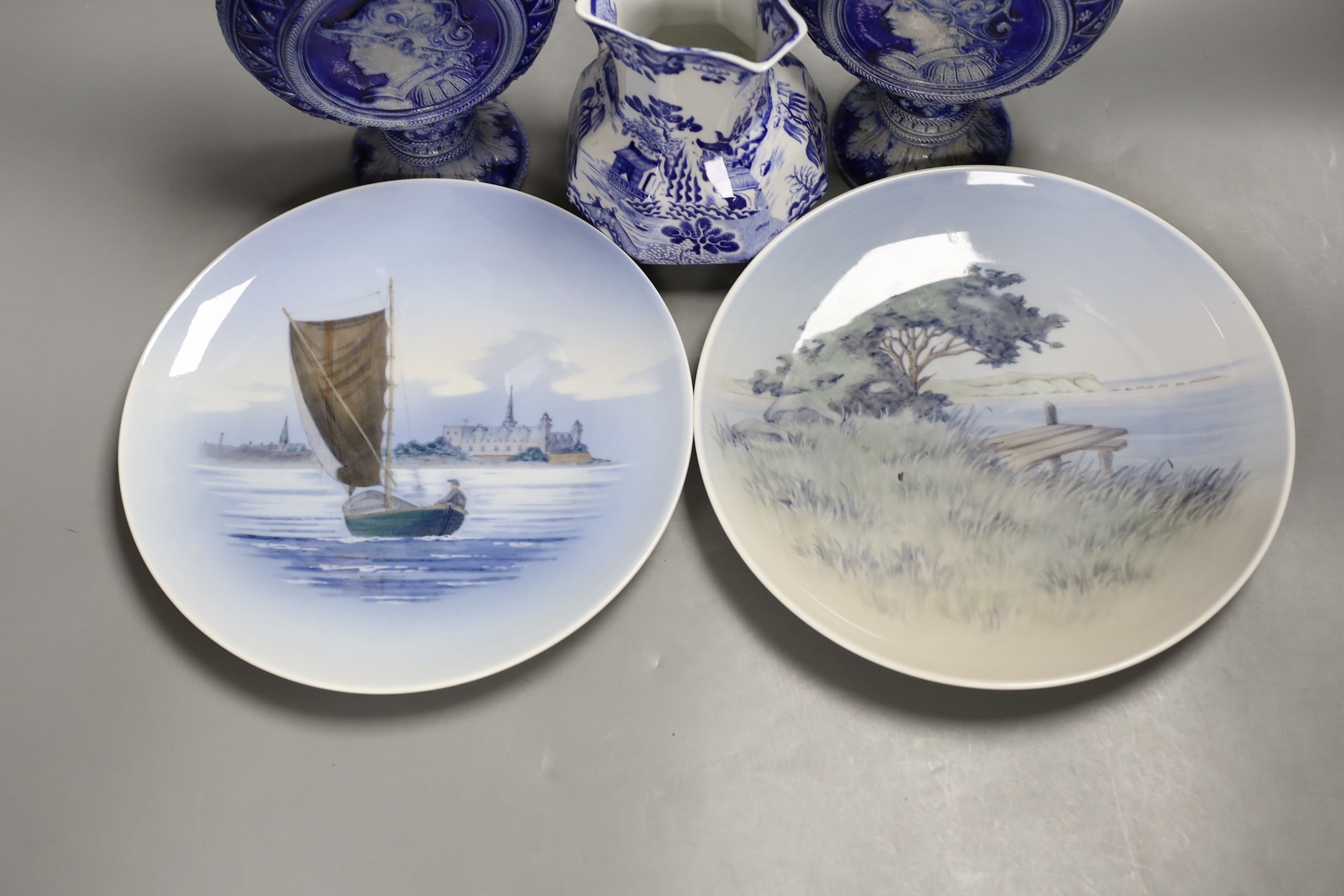 A pair of Royal Copenhagen plates, a pair of German pottery ewers a blue and white dish and pickle dish, plates 25 cms diameter.